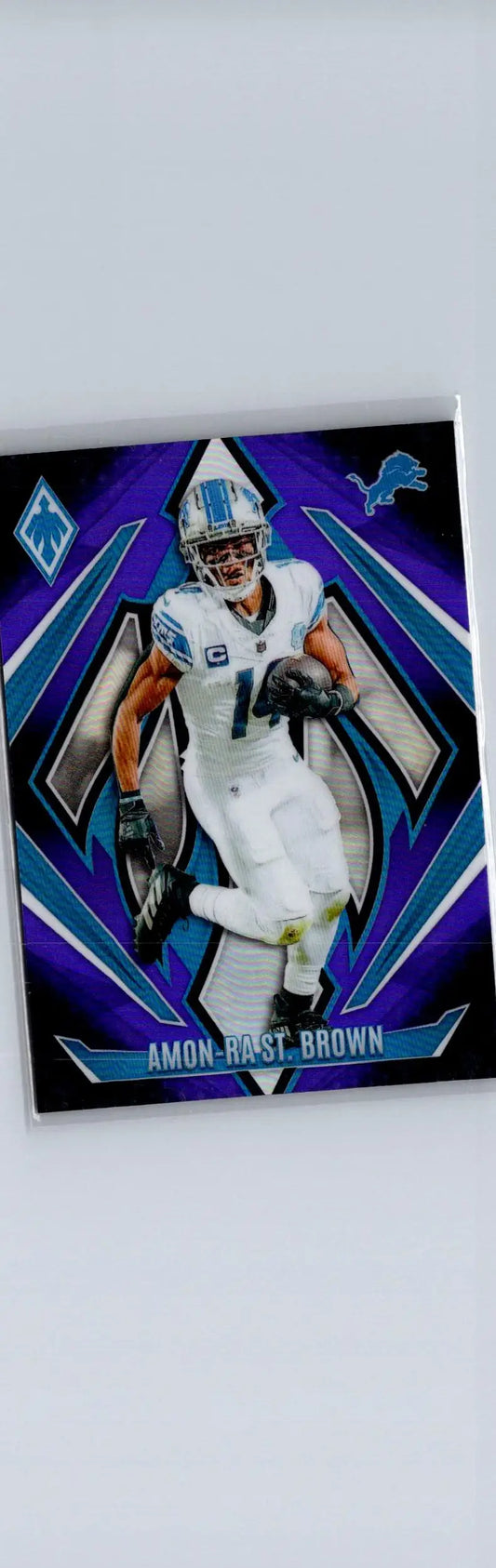 Amon-Ra St. Brown football card from 2024 Panini Phoenix Purple Fade collection