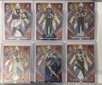 Six Panini Phoenix Fireburst Prizm trading cards in plastic holders from 2024 Panthers lot