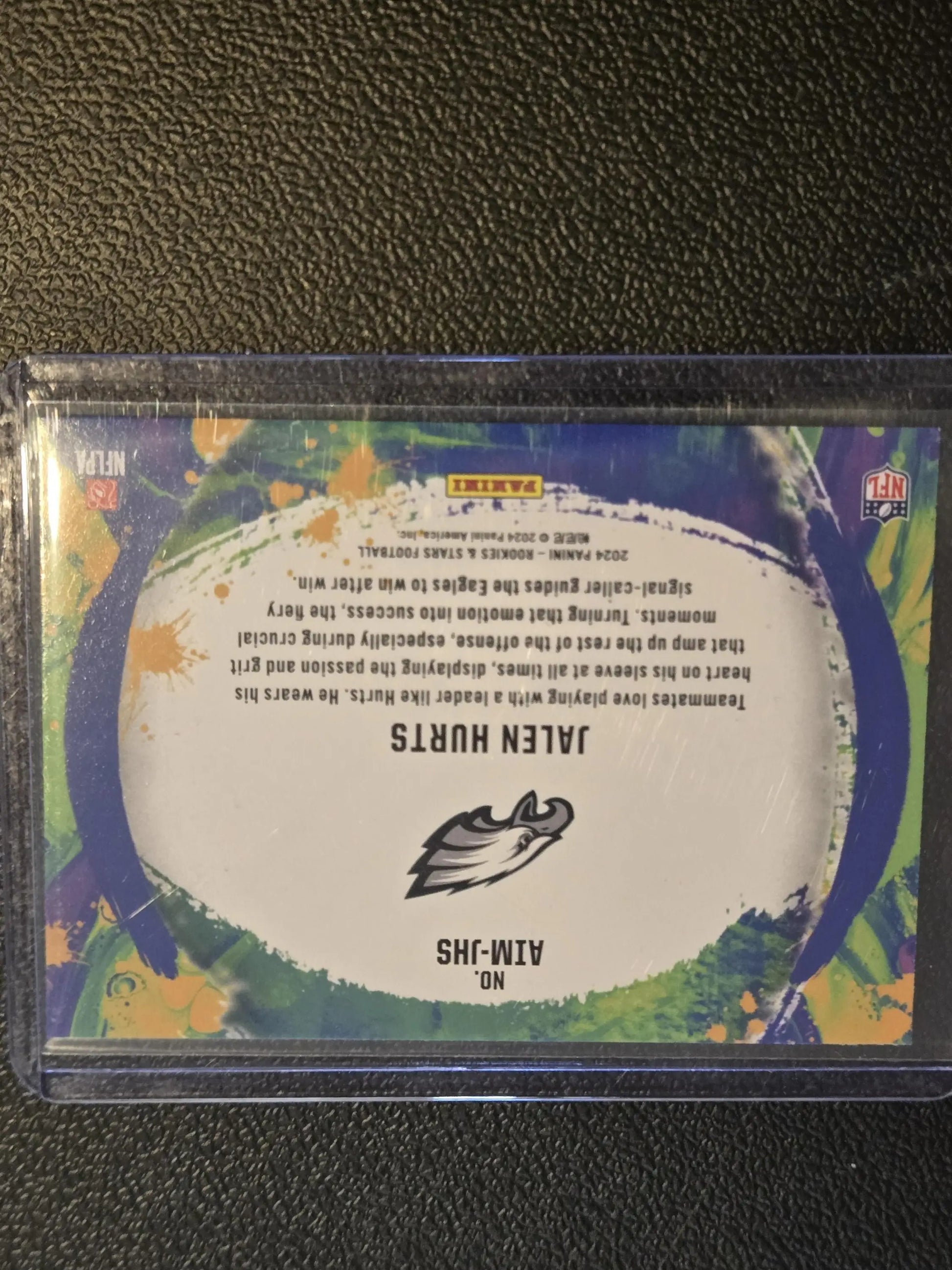 Sports trading card of Jalen Hurts in protective case from Panini Rookies 2024
