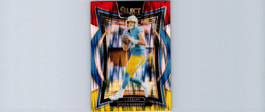 2022 Select Justin Herbert football trading card featuring Red & Yellow Prizm Shock design
