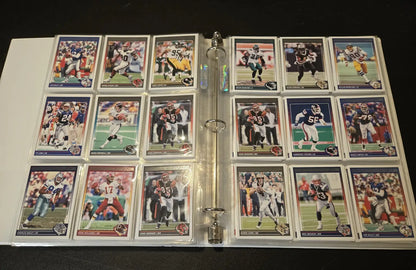 Score Football binder filled with 2024 trading cards featuring stars and legends