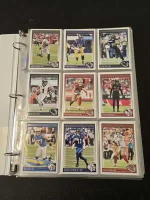 Score Football trading cards displayed in a clear binder page from 2024 Score Football Binder Lot