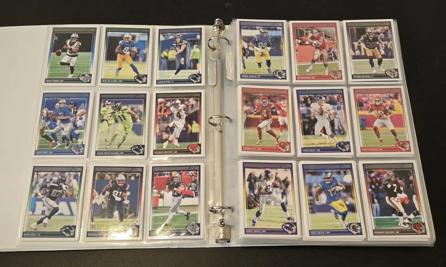 Binder of collectible Score Football cards with stars, legends, and base cards in a 2024 album