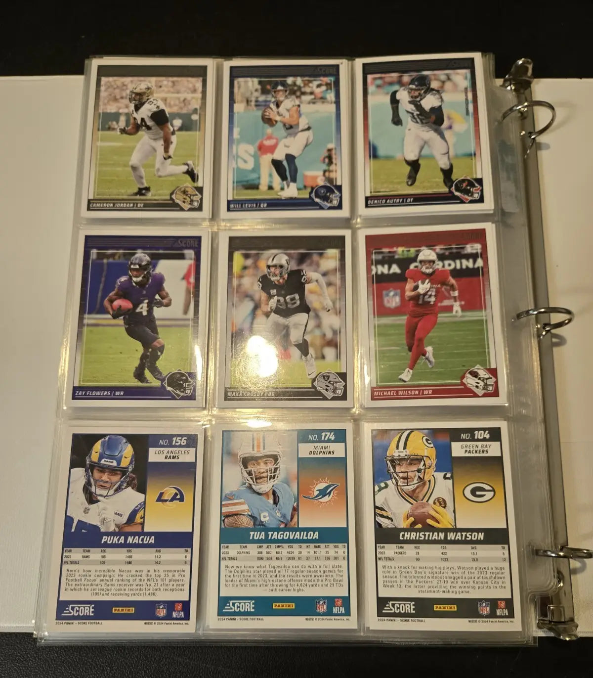 Binder of Score Football trading cards featuring stars legends and base cards