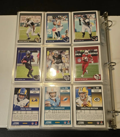 Binder of Score Football trading cards featuring stars legends and base cards