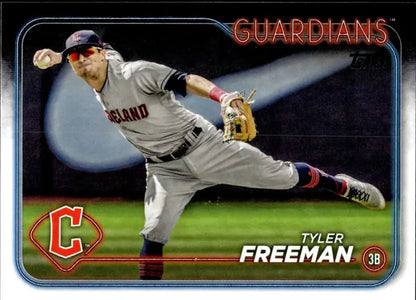 Cleveland Guardians player Tyler Freeman stretching for a defensive play in baseball action