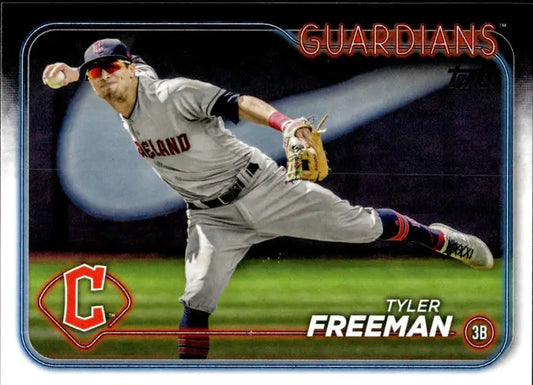 Cleveland Guardians player Tyler Freeman stretching for a defensive play in baseball action