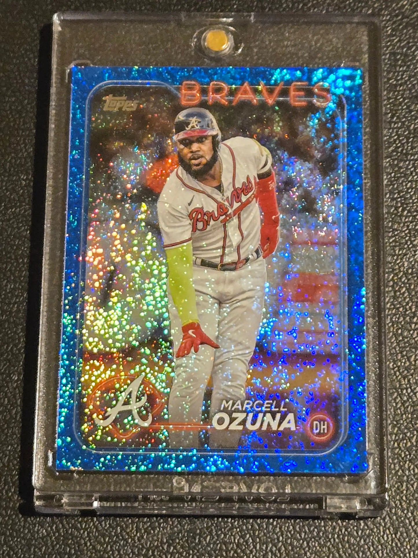 Blue glitter Marcell Ozuna baseball card in protective case, 2024 Topps Ozuna Blue Holofoil