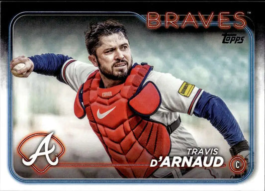 Atlanta Braves baseball card of Travis d’Arnaud in throwing motion with red gear
