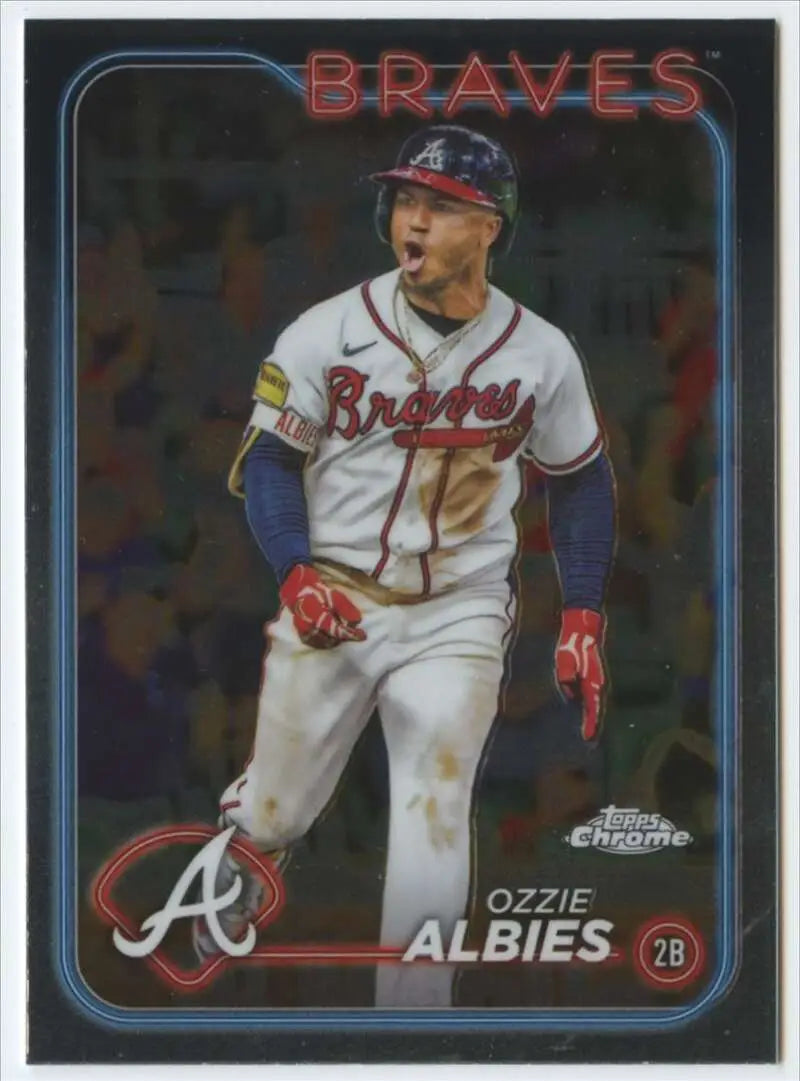 Ozzie Albies celebrating in white home uniform on 2024 Topps Chrome Atlanta Braves card