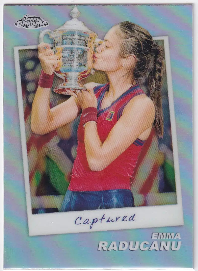 Tennis player Emma Raducanu kisses US Open trophy in Topps Chrome Captured card