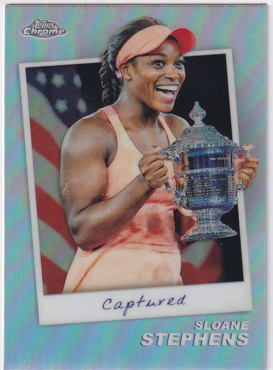 Sloane Stephens smiling with the US Open trophy in Topps Chrome Captured outfit