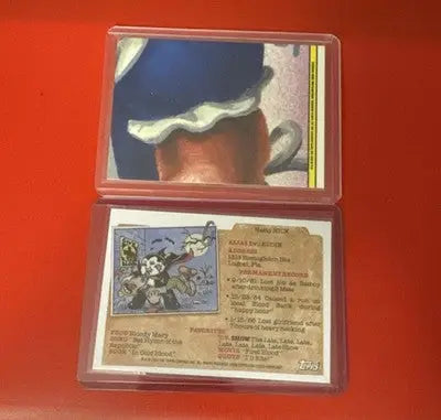 Collectible Garbage Pail Kids trading cards in protective sleeves from 2024 Topps Chrome