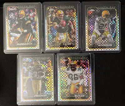 Green Bay Packers Topps Chrome trading cards in protective cases featuring Favre Woodson Freeman