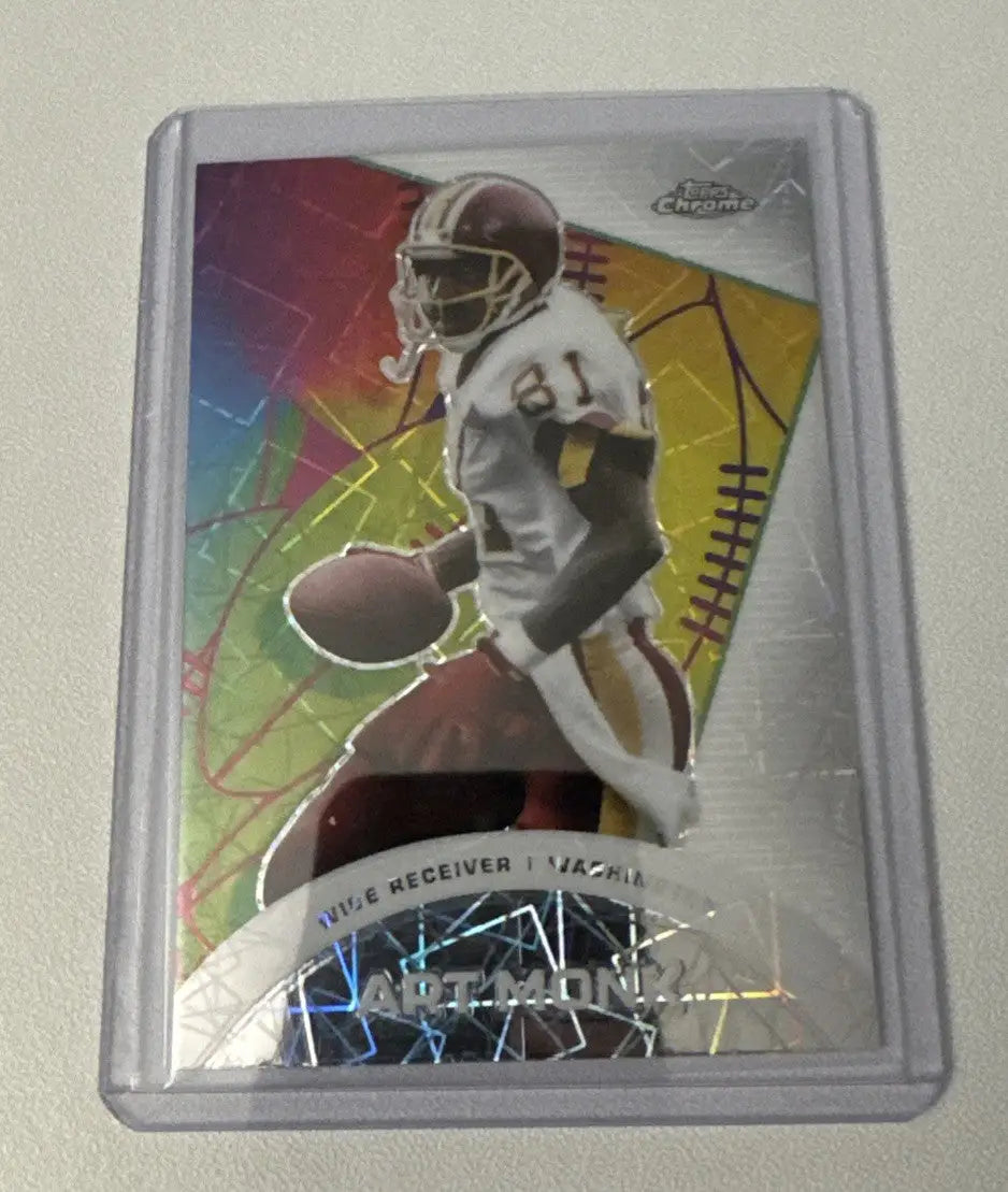 Football trading card in protective case featuring 2024 Topps Chrome Art Monk Laser Refractor