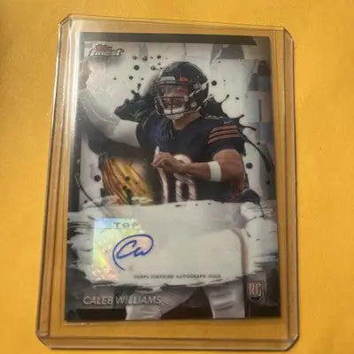 Autographed Caleb Williams rookie football card in protective case from Topps Finest Rookie Finest Autographs
