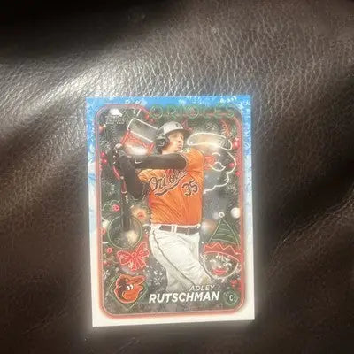 2024 Topps Holiday Adley Rutschman trading card featuring holiday tree design