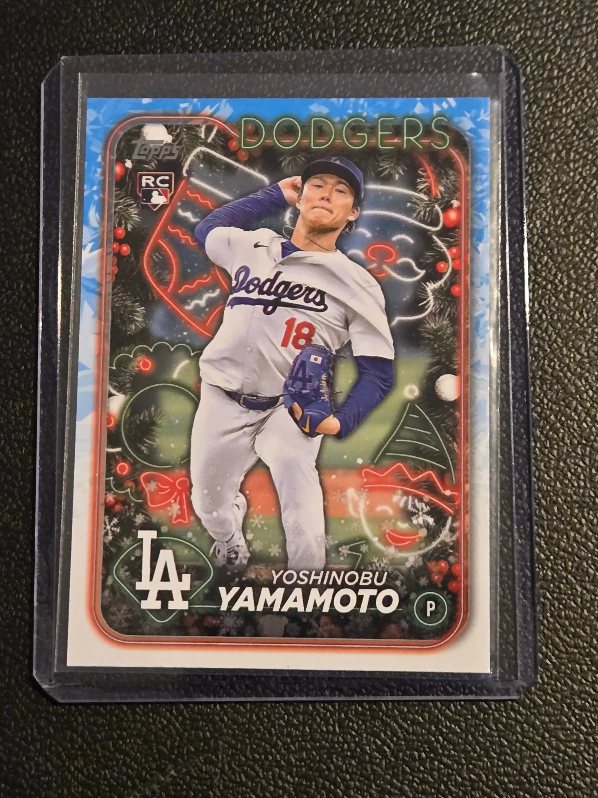 Baseball trading card of Yoshinobu Yamamoto in holiday-themed Dodgers uniform, 2024 Topps H88b