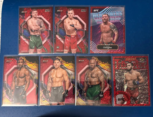 Collection of UFC trading cards featuring 2024 Topps Red Shimmer design