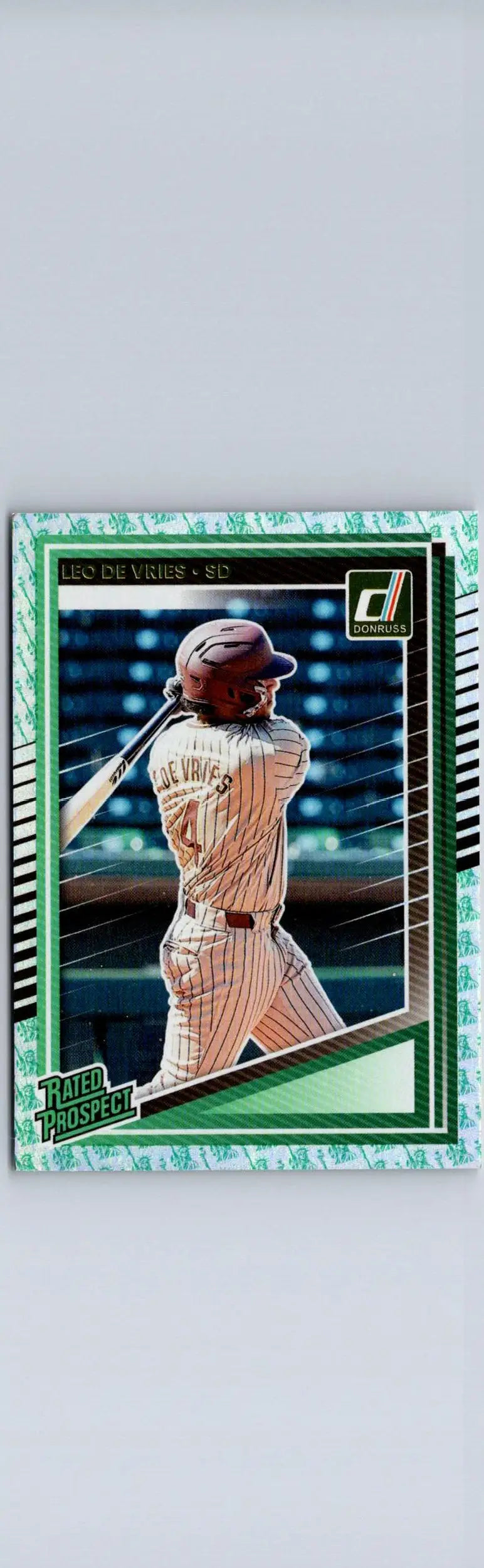 Baseball trading card of Leo De Vries swinging bat with green border and patterned design