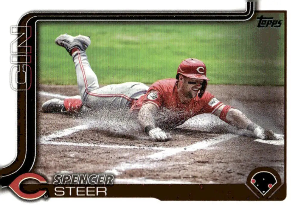 2025 Topps Spencer Steer Cincinnati Reds baseball card with sliding into home image