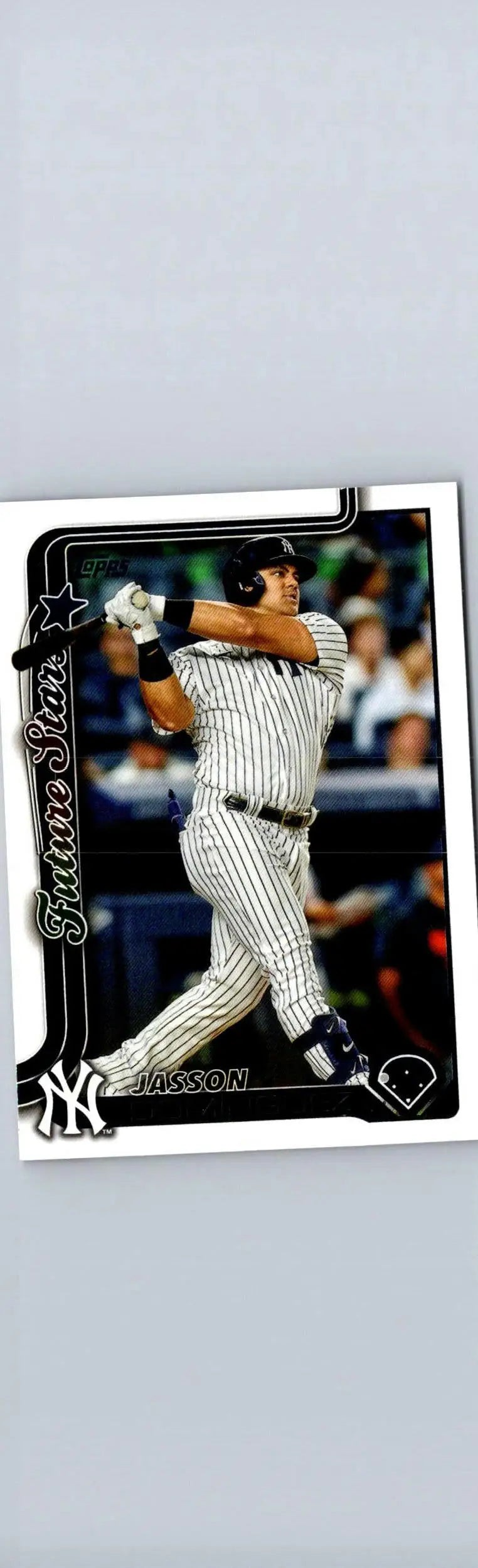 Baseball card featuring Jasson Domínguez in pinstriped Yankees uniform mid-swing