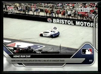 White and blue high-performance home run car with rear spoiler at NASCAR track