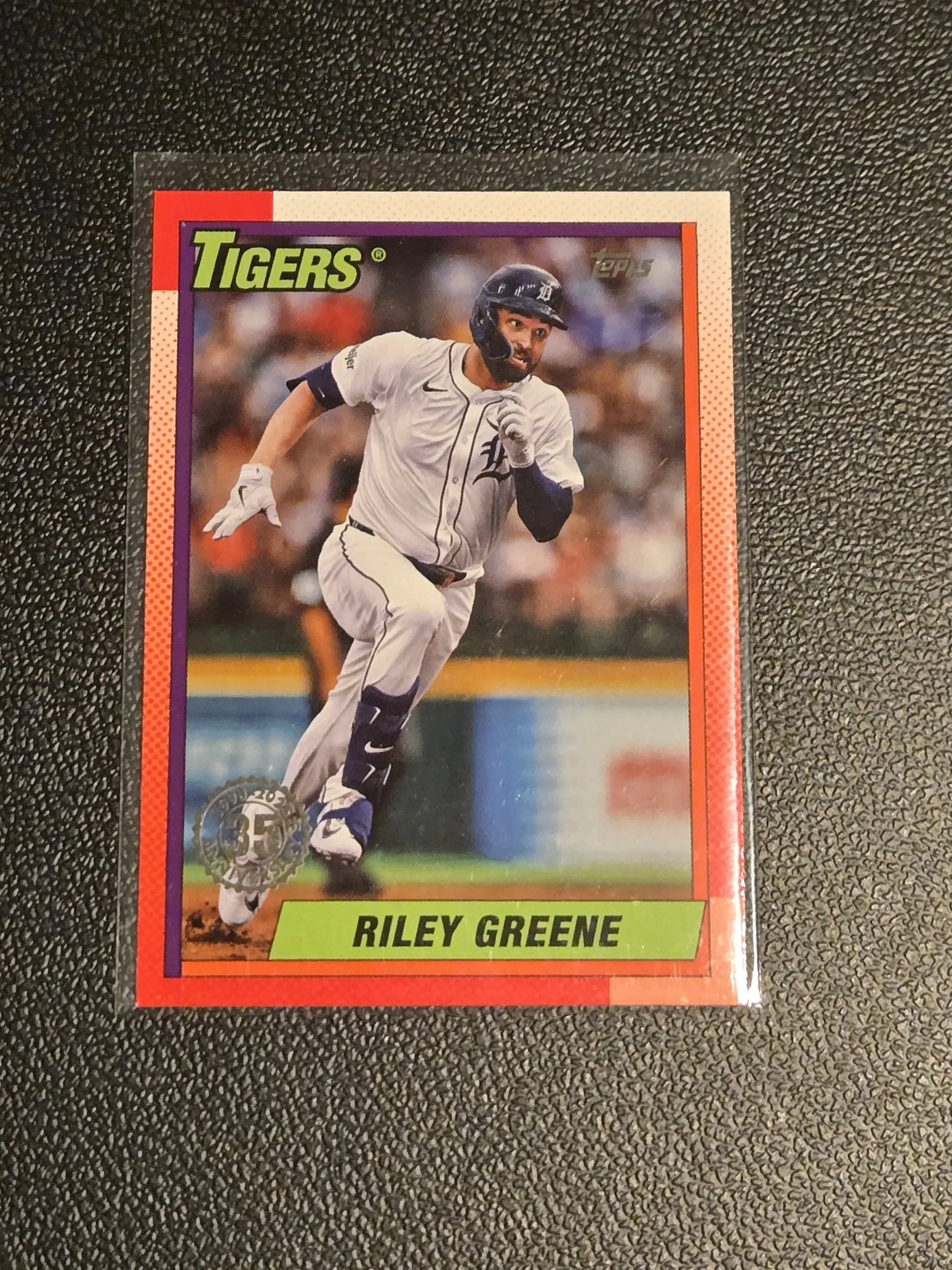 Baseball trading card of Riley Greene in protective sleeve from 2025 Topps Riley Greene 35th Anniversary series