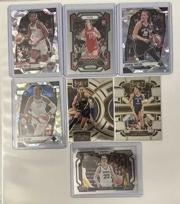 Collection of WNBA basketball trading cards in protective cases from 2025 WNBA All-Star card lot