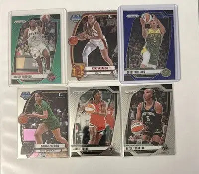 Collection of six WNBA basketball trading cards featuring female players in a card lot