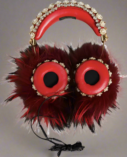 Red headphones with fur and decorative elements on a white background