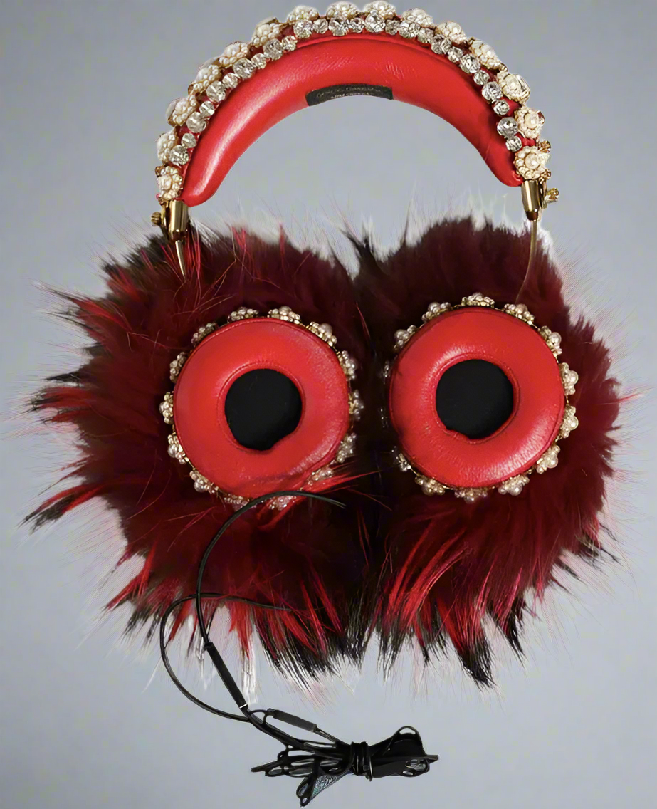 Red headphones with fur accents and decorative elements on a white background