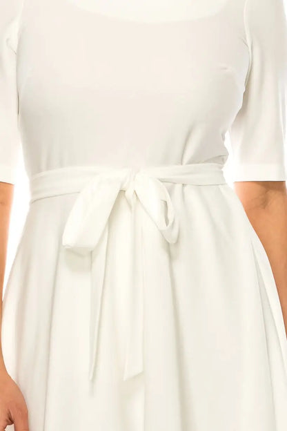 Maison Tara day dress in azure blue with a tied waist belt, available in sizes 4/6/8
