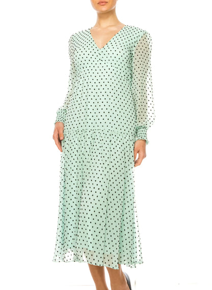 Light green maison tara midi dress with black polka dots, V-neck, long sleeves, ruffled hem