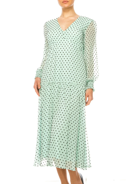 Light green maison tara midi dress with black polka dots, V-neck, long sleeves, ruffled hem
