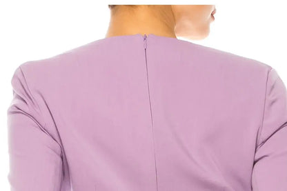 Nicole Miller Rhapsody illusion long-sleeved top shown from the back with zipper closure