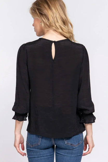 Black long-sleeved blouse with crochet lace panel and lace panel flounce cuffs