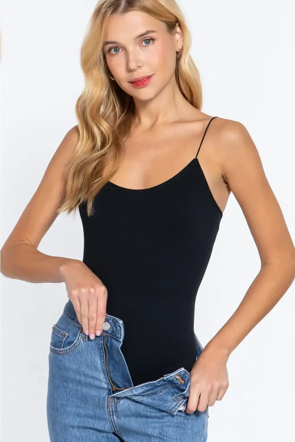 Woman wearing ACTIVE BASIC Ribbed Round Neck Seamless Cami Bodysuit with light-wash jeans