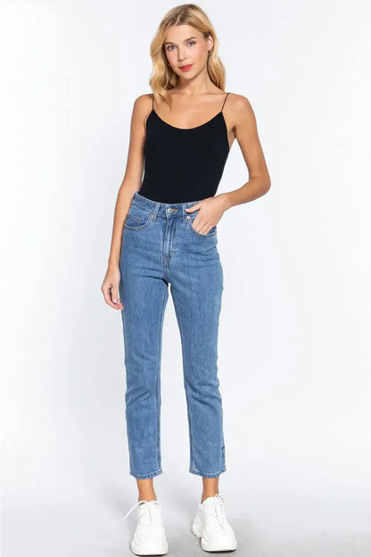 Women’s black ribbed round neck camisole top with high-waisted jeans for a stylish look