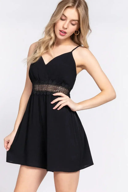 Black mini dress with spaghetti straps and waist lace trim for stylish lace trim cami look