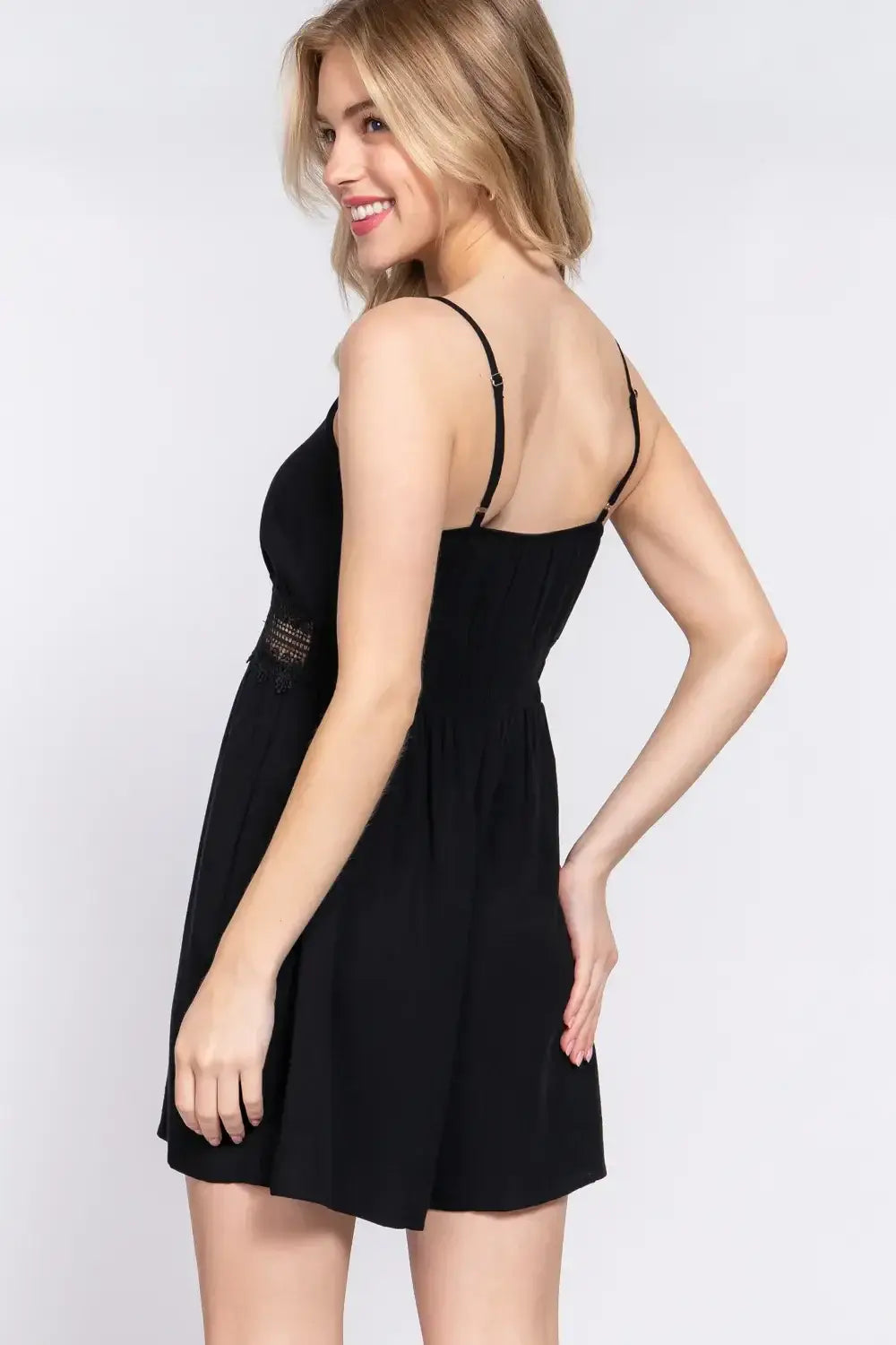 Black spaghetti strap babydoll dress with waist lace trim for a lace trim cami look