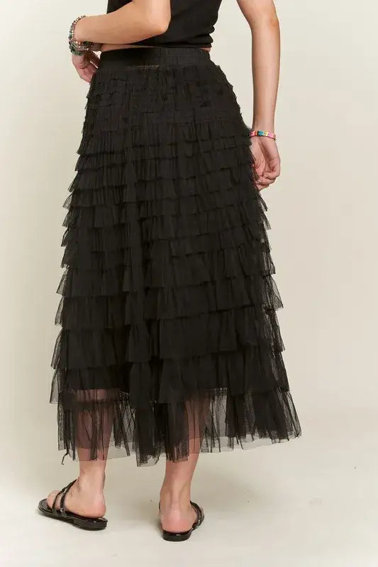 Black layered mesh midi skirt with elastic waist and sandals for stylish summer wear
