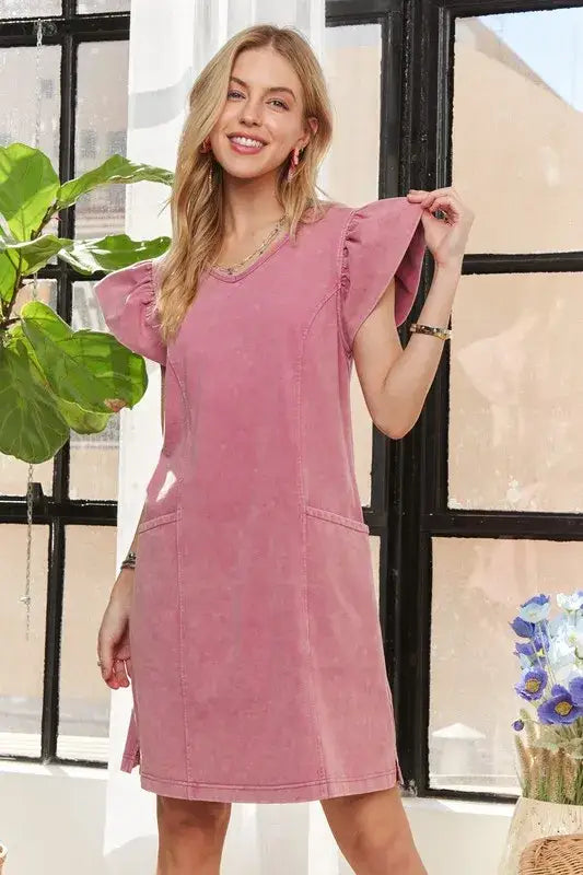 Woman wearing a faded mauve-pink ADORA Mineral Washed V-Neck Ruffled Cap Sleeve Dress