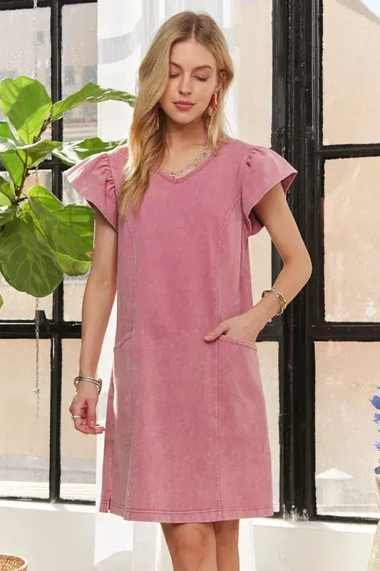 Woman modeling ADORA Mineral Washed V-Neck Ruffled Cap Sleeve Dress in pink