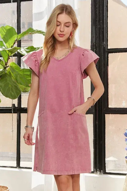 Woman modeling ADORA Mineral Washed V-Neck Ruffled Cap Sleeve Dress in pink