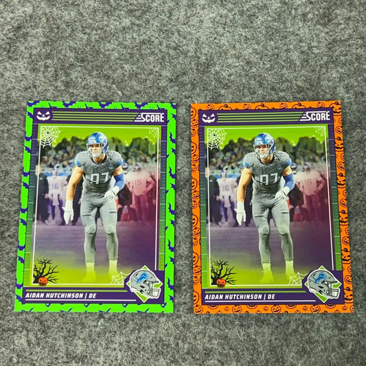 Halloween-themed Aidan Hutchinson football trading cards with green and orange borders