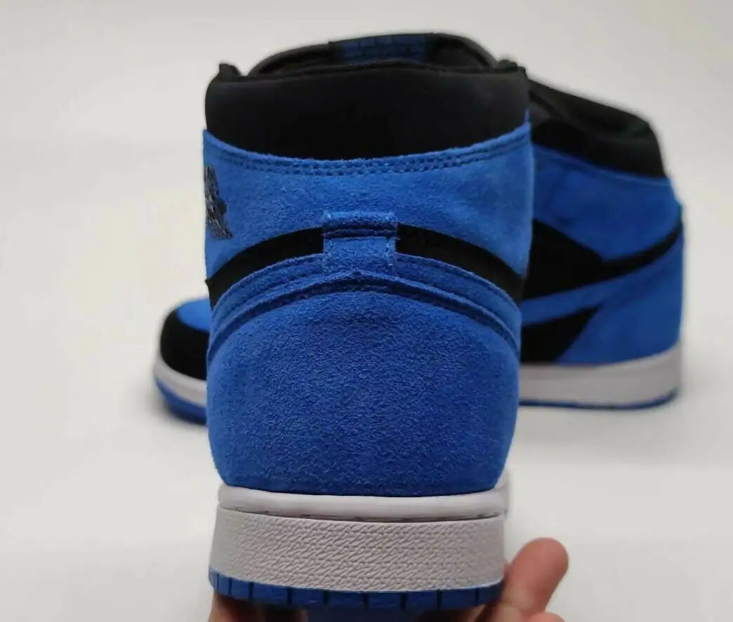 Air Jordan 1 High OG Royal Blue Reimagined Black suede sneakers with white soles, fast shipping