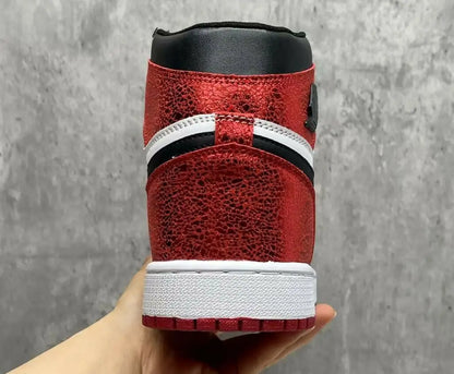 Air Jordan 1 High OG Ruby sneaker with red and black textured upper, fast shipping