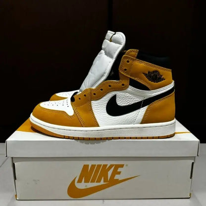 High-top Nike Air Jordan 1 High Yellow Ochre sneaker with white, mustard yellow, and black accents for fast shipping within business days