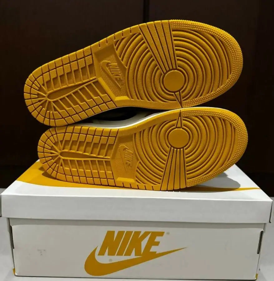 Yellow and black Nike Sneakers with grooved soles on white Nike shoebox for fast shipping
